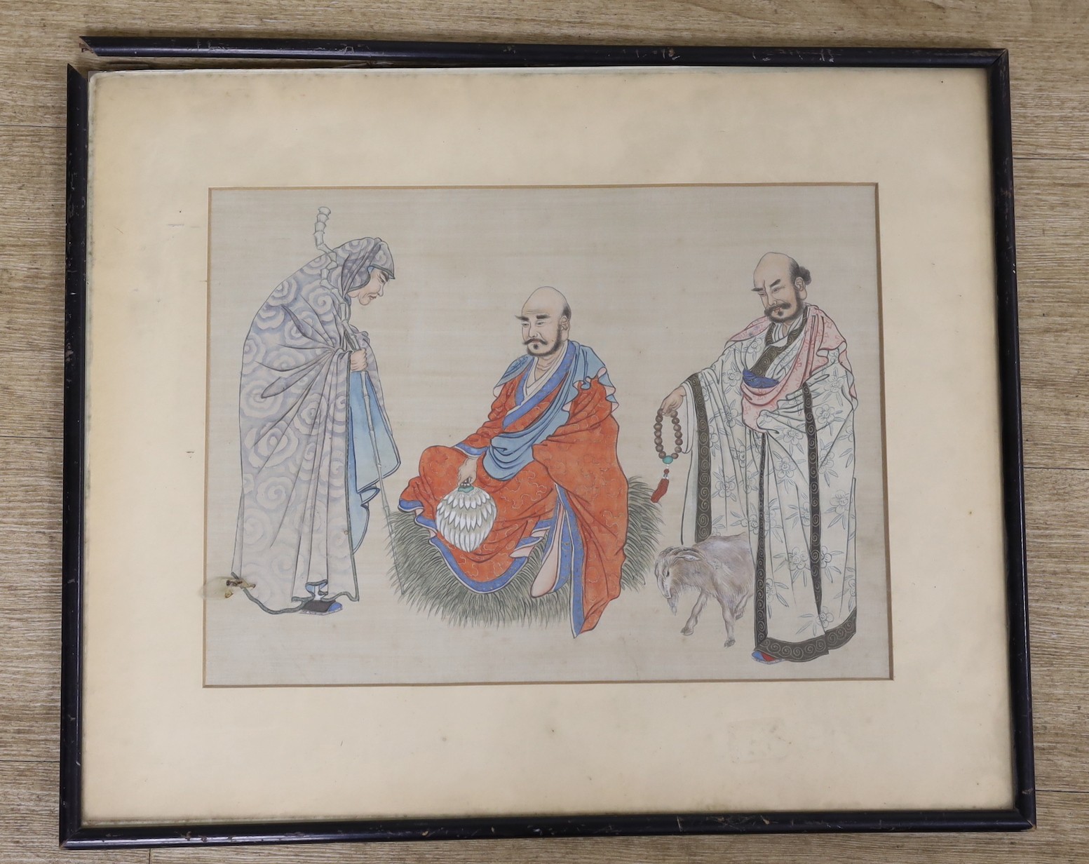 A Chinese painting on silk of three luohan, early 20th century, 38 cms wide x 28 cms high.